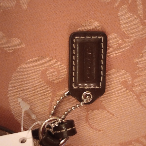 Nwt. Coach Signature C Brown and tan wristlet. - Picture 6 of 6